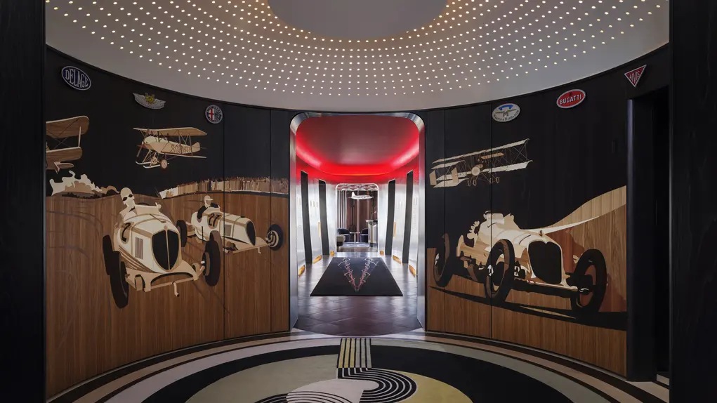 Entrance to Brooklands restaurant with motor car images on the walls 