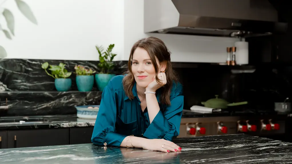 lady leaning on kitchen counter