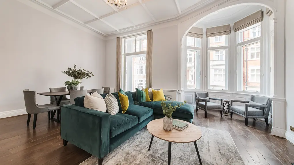 Living room with green sofa