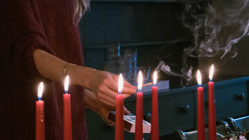 woman lighting candles