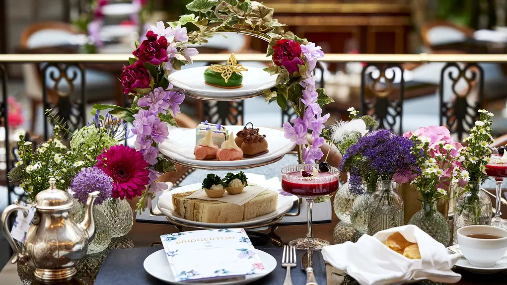 Afternoon tea with flowers on a tiered plate