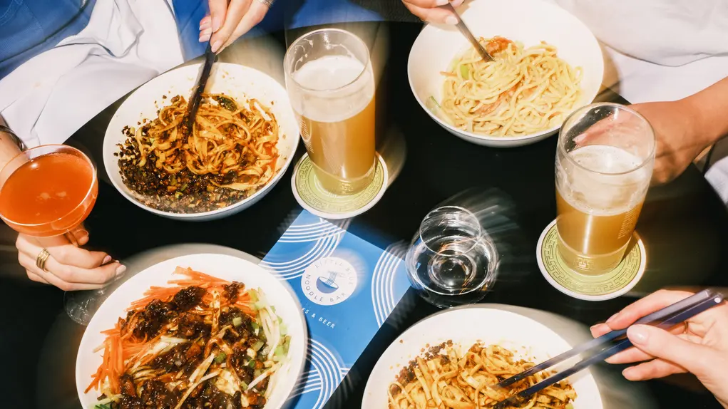 food on a table with people eating