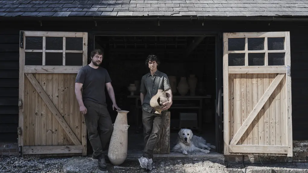 two men at a barn