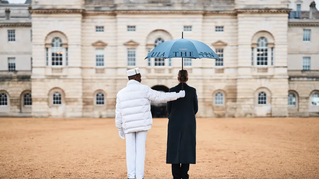 two people outside with umbrella