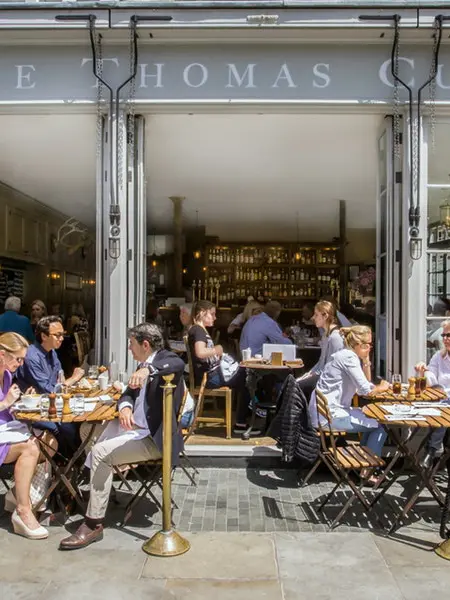 people eating outside The Thomas Cubitt pub