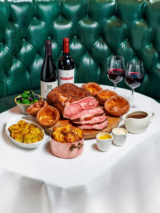 A Sunday roast with two glasses of wine