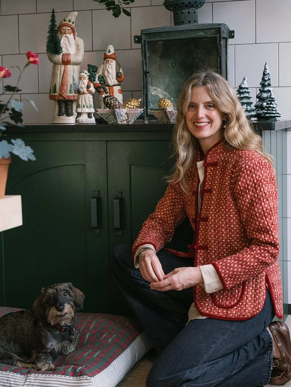 woman with dog in kitchen