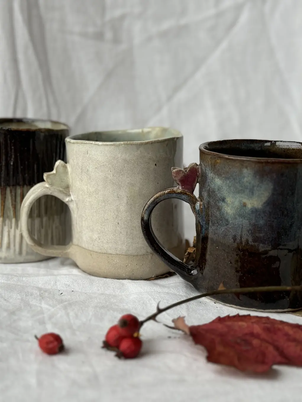 Three ceramic mugs