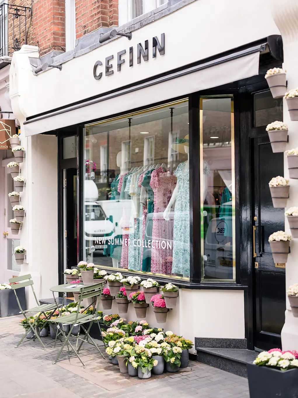 Cefinn with pots of flowers outside