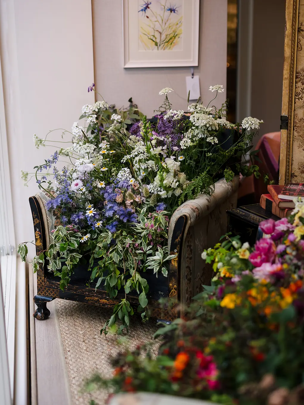 Chairs filled with flowers at The Odd Chair Company