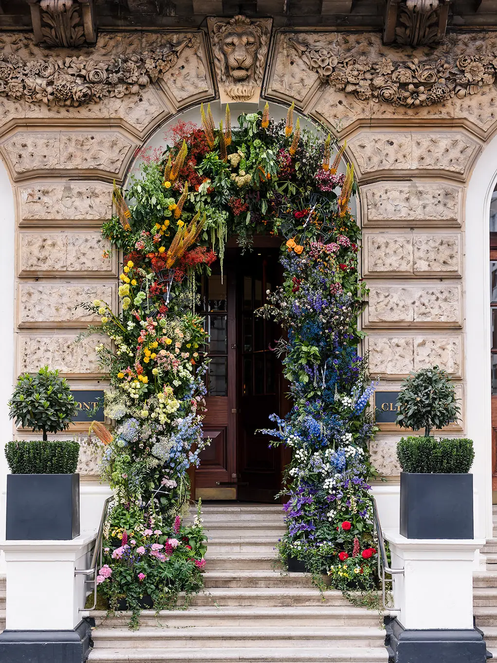 Clermont Hotel with a floral archway