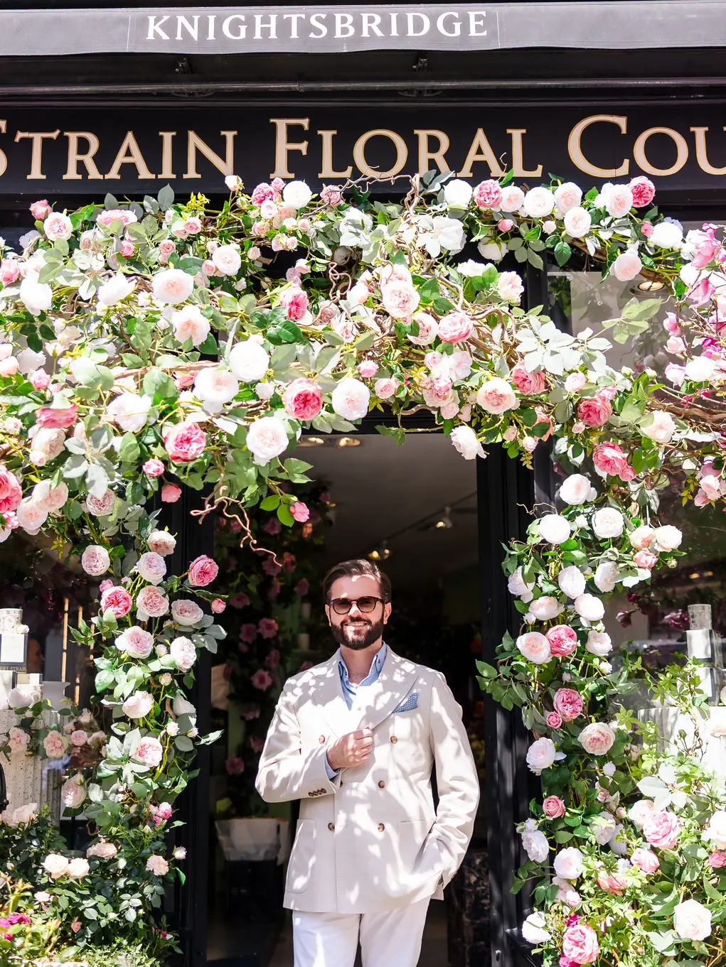 Neill standing outside his shop