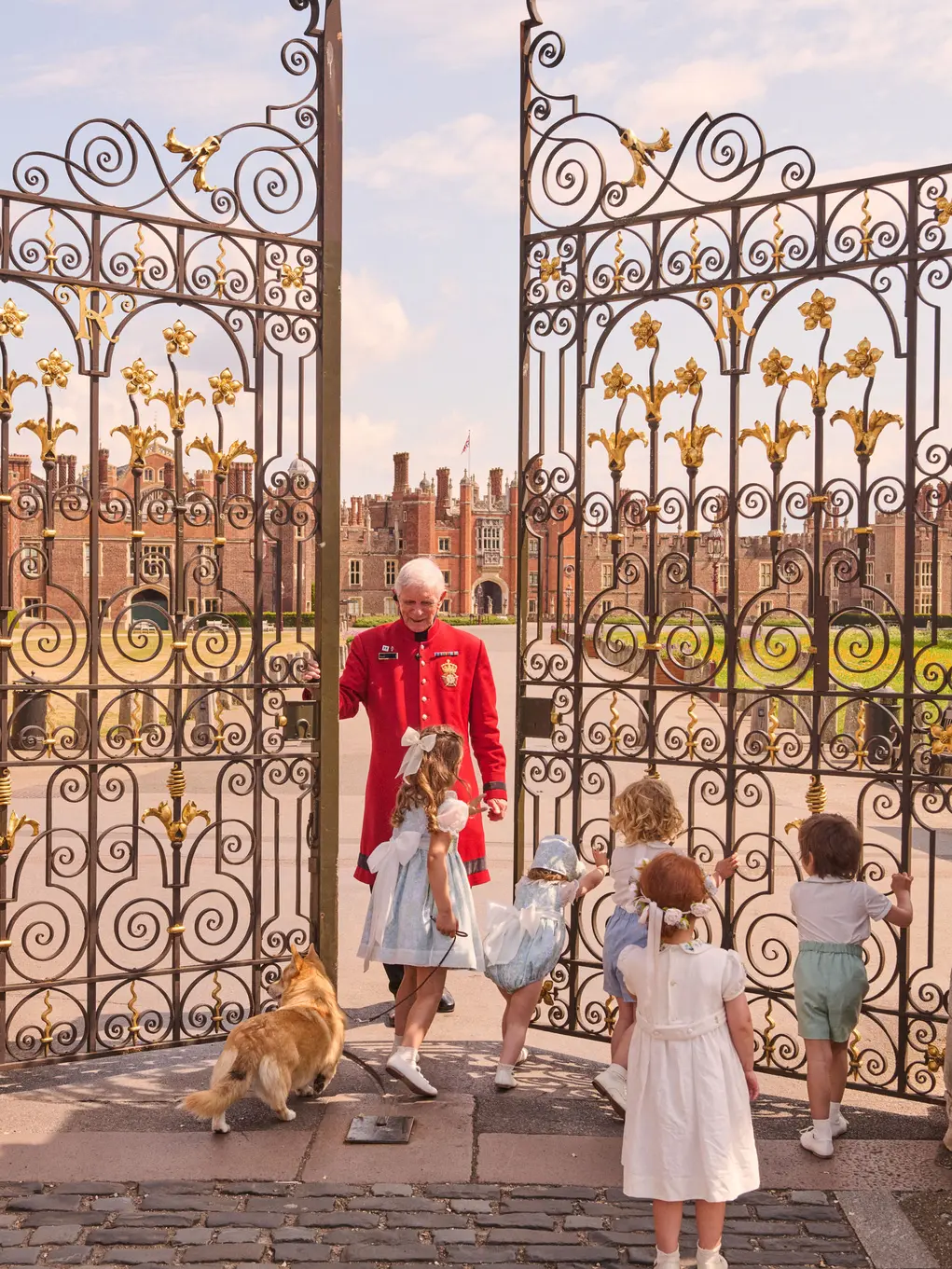 children with man and dog opening gate