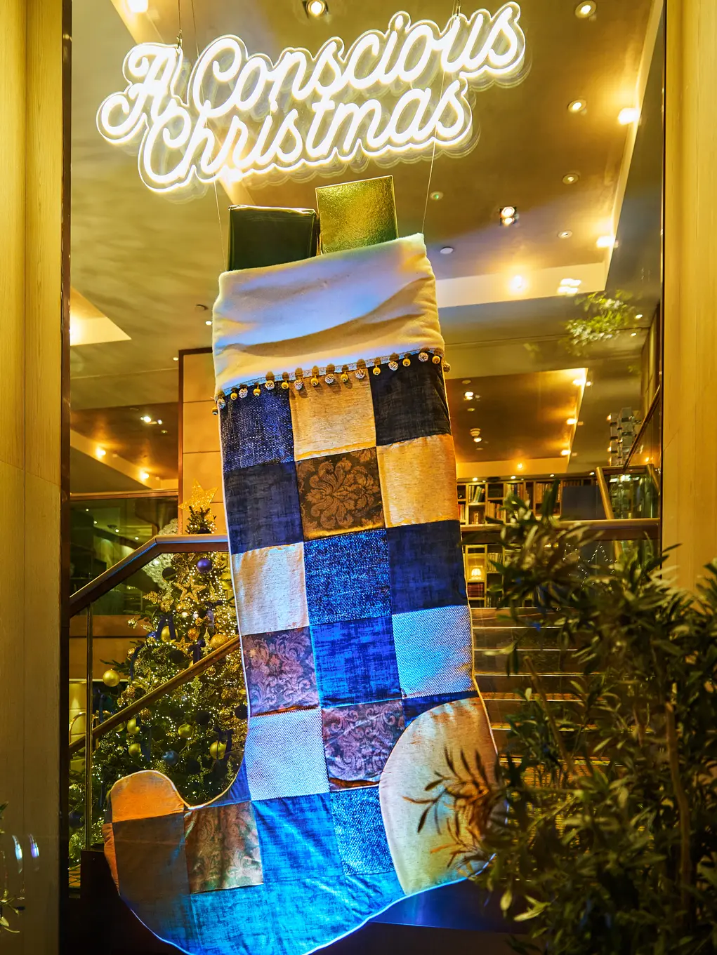 Window display showing a stocking and the words 'A Conscious Christmas' 
