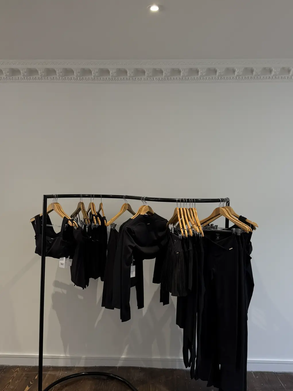 clothes on a rail in a shop