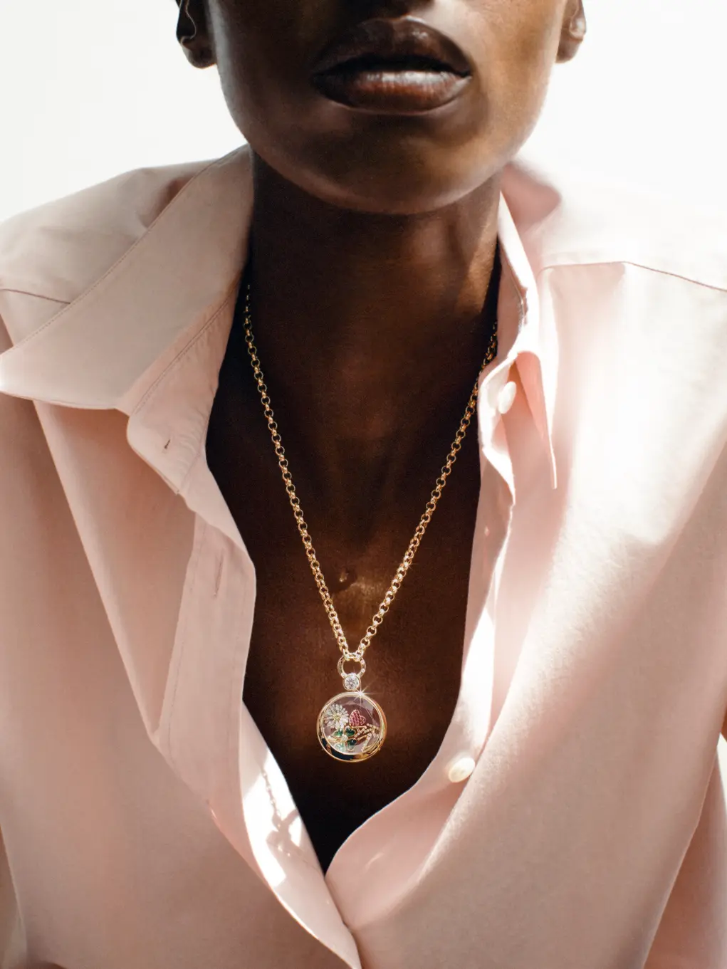 A model wearing a locket from Loquet