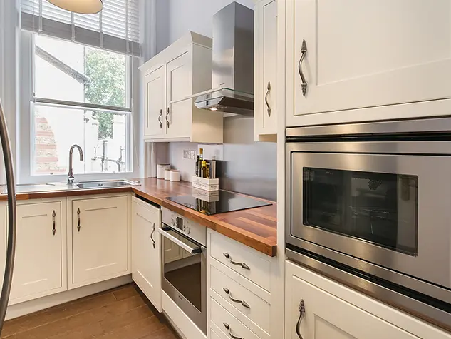 Kitchen with white cupboards