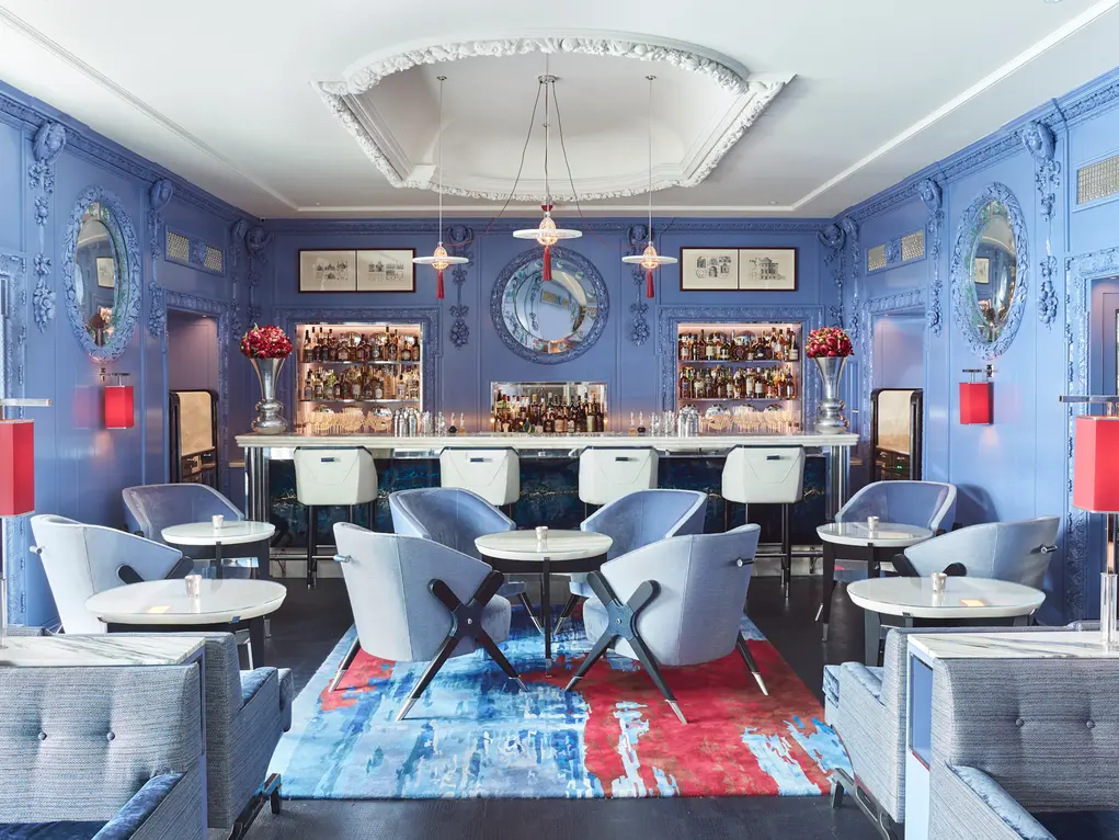 A bar with blue walls and blue furniture