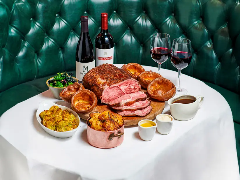 A Sunday roast with two glasses of wine