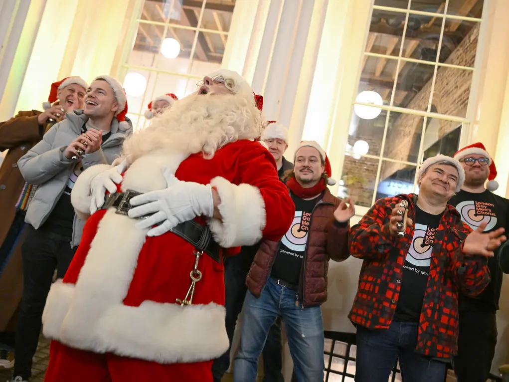 Santa and a choir singing